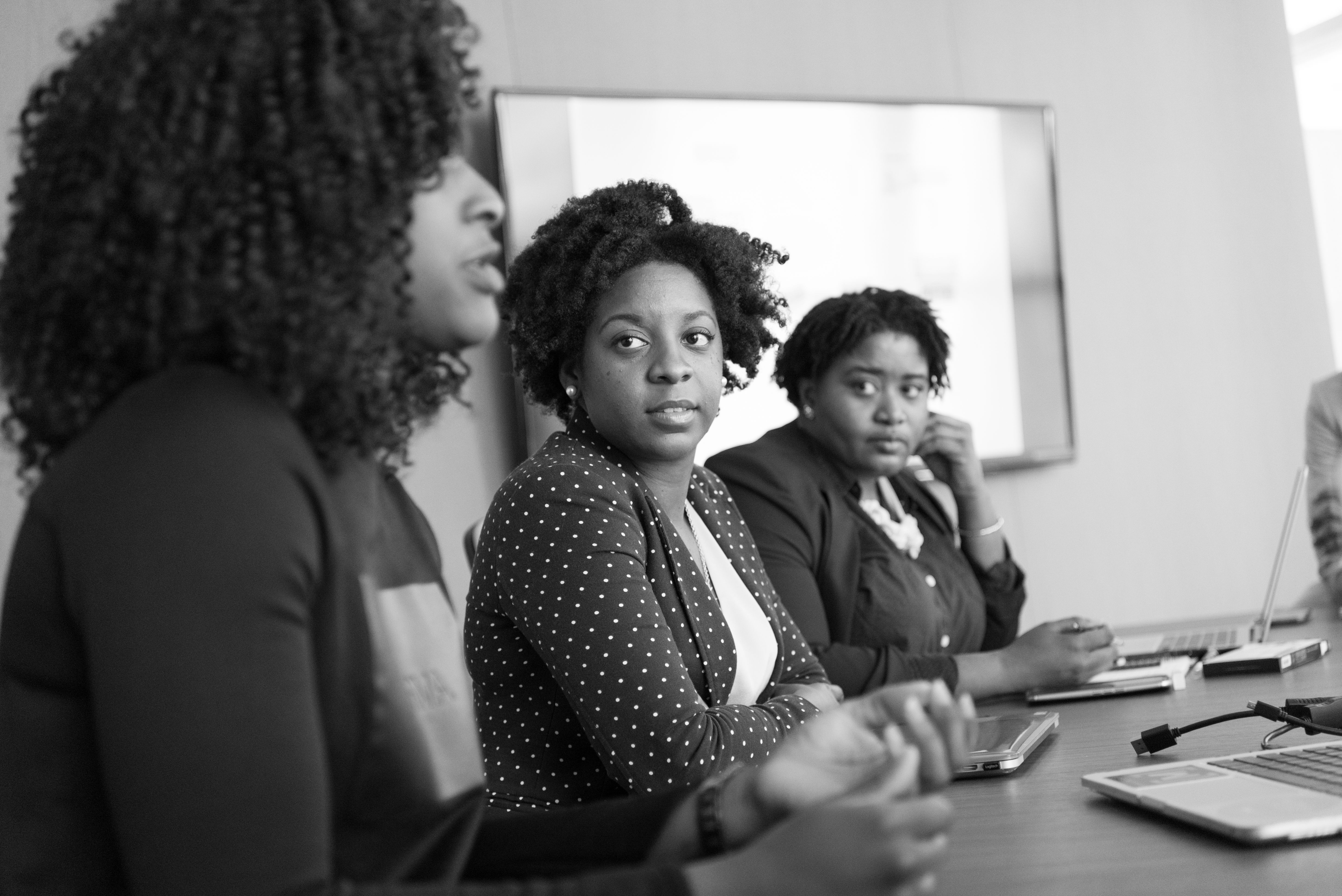 Business professionals reviewing commercial information together at a table